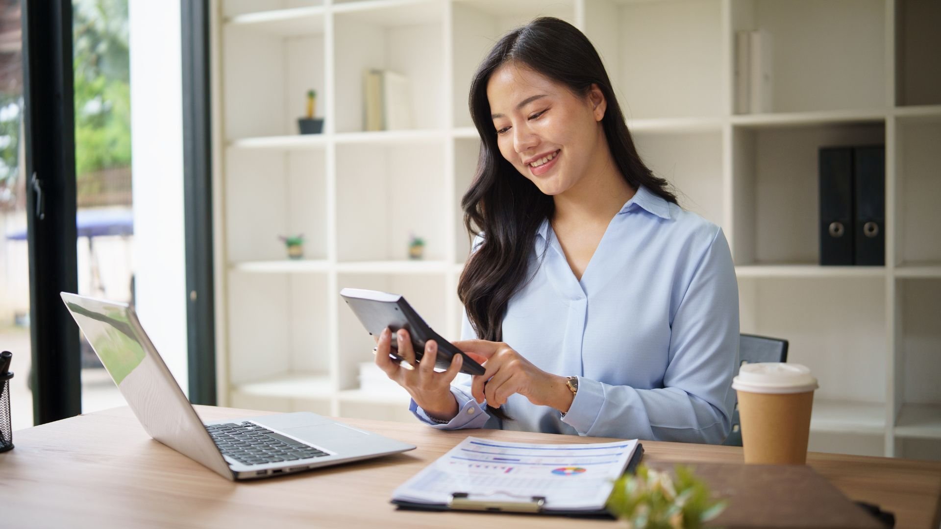 Small business owner reviewing financial dashboard with a bookkeeping partner focused on strategic decision-making.