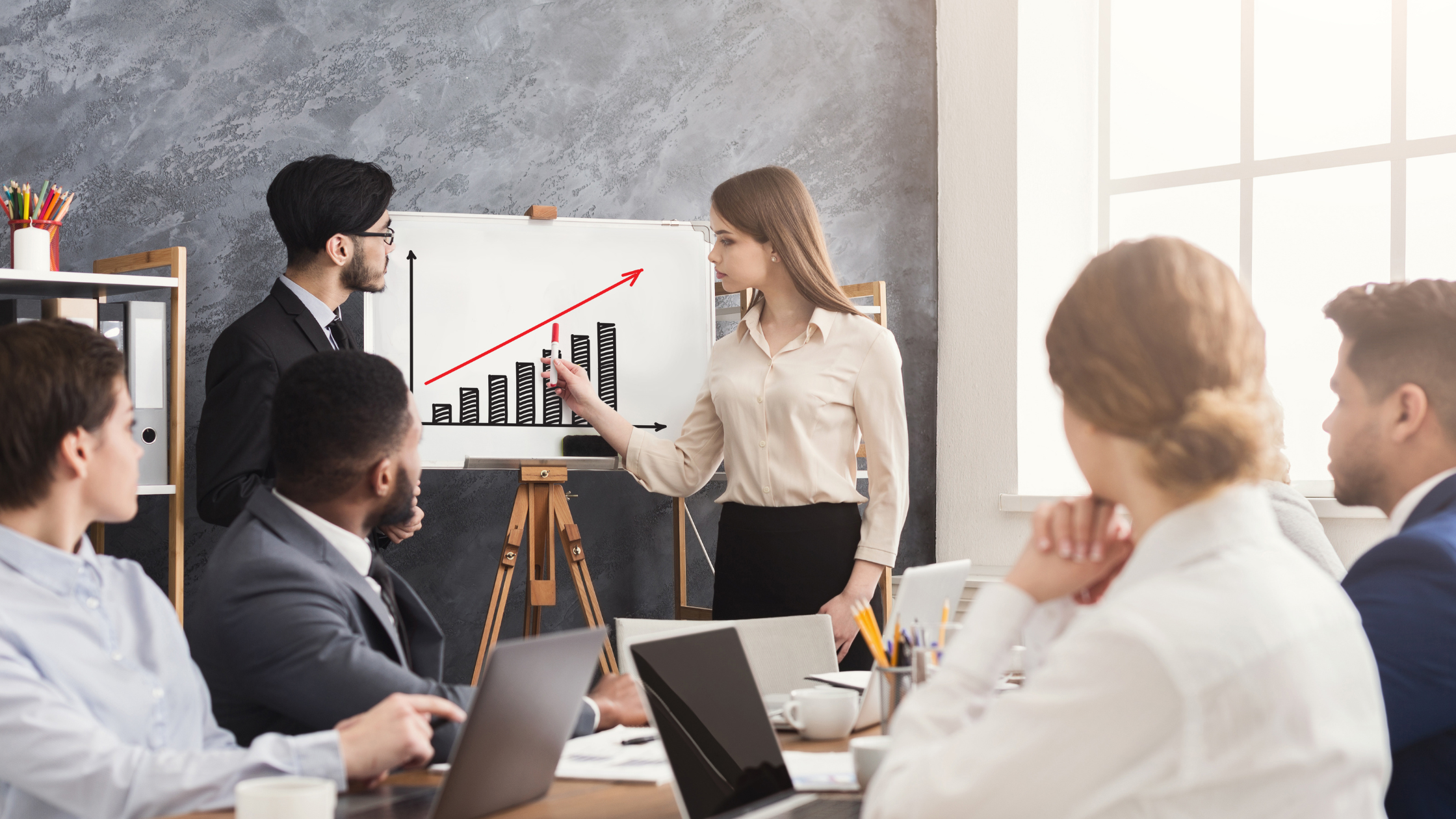 Business owner reviewing financial reports and bookkeeping practices to improve profitability.